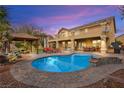 Inviting backyard pool with a gazebo and plenty of space for outdoor entertaining at 9011 Tierra Santa Ave, Las Vegas, NV 89129