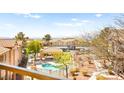 Overhead view of community pool and surrounding buildings on a sunny day at 2110 Los Feliz St # 2075, Las Vegas, NV 89156