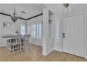 Elegant dining room featuring stylish chandelier and natural light from shuttered windows at 3215 Lubec Valley Ln, Henderson, NV 89074