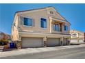 Inviting two-story townhome featuring a three-car garage and charming balcony at 3313 Jamaica Princess Pl # 3, North Las Vegas, NV 89084