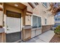 Charming townhome entrance, showcasing neutral tones and a welcoming front door at 3313 Jamaica Princess Pl # 3, North Las Vegas, NV 89084