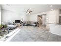 Spacious living room with neutral paint, tile flooring, and recessed lighting at 3807 Andorian Ave, North Las Vegas, NV 89084