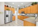 Bright kitchen features stainless steel appliances, ample counter space, and wood cabinetry at 482 Bonnie Brook Pl, Henderson, NV 89012