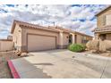 Charming single-story home featuring a tile roof, two-car garage, and well-maintained landscaping at 576 Bayo Canyon Ct, Henderson, NV 89015