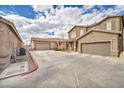 View of the property featuring a two-car garage and driveway in a residential neighborhood at 576 Bayo Canyon Ct, Henderson, NV 89015