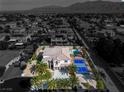 High-definition aerial view of property highlighting the backyard sports court, pool, and attractive landscaping at 6214 Ebony Legends Ave, Las Vegas, NV 89131