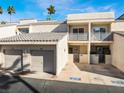 Charming two-story townhome with a private garage, covered entrance, and well-manicured landscaping at 6250 W Flamingo Rd # 28, Las Vegas, NV 89103