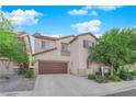 Two-story home featuring a two-car garage, driveway and lawn at 8036 Maple Park St, Las Vegas, NV 89131