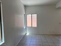 Bedroom with tile flooring and natural light from the windows at 8301 Strawberry Spring St, Las Vegas, NV 89143