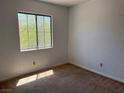 Bedroom featuring a window with a view of lush greenery at 8301 Strawberry Spring St, Las Vegas, NV 89143