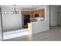 Bright kitchen featuring wood cabinets, and black appliances at 8301 Strawberry Spring St, Las Vegas, NV 89143