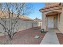 View of the side yard featuring a desert landscape with low-maintenance gravel at 9177 Bucksprings Dr, Las Vegas, NV 89129