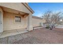 A low-maintenance side yard with desert landscaping next to the house at 9177 Bucksprings Dr, Las Vegas, NV 89129