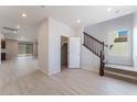 Spacious living area featuring sleek tile flooring, abundant natural light, and an open floor plan at 9333 Observatory St, Las Vegas, NV 89143