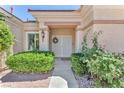 Inviting front door with manicured landscaping and brick-paved entrance at 1596 Fieldbrook St, Henderson, NV 89052