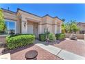 Attractive front entrance featuring a brick walkway and neatly landscaped bushes at 1596 Fieldbrook St, Henderson, NV 89052