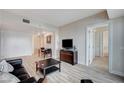 Bright living room with wood floors, a contemporary entertainment center, and neutral décor, perfect for relaxing at 2700 Las Vegas Blvd # 3507, Las Vegas, NV 89109