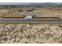 Expansive property featuring a well-maintained home, circular driveway, and desert landscape, providing privacy at 3181 W Bell Vista Ave # 2, Pahrump, NV 89060