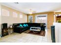 Bright living room with tiled floors, and a sectional sofa at 5040 Copperlyn St, Las Vegas, NV 89122