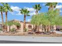 Inviting single-story home with palm trees and desert-friendly landscaping at 5192 Estasi St, Las Vegas, NV 89135