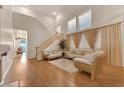 Open concept living room with high ceilings, and hardwood floors at 8512 Porch Rocker St, Las Vegas, NV 89143