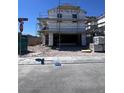 New two-story home under construction with scaffolding and an attached two-car garage at 9059 Rivington Ave, Las Vegas, NV 89148
