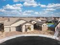 Beautiful single story home boasting desert landscaping, an attached two car garage, and a backyard sport court at 10420 Luella Ct, Las Vegas, NV 89143