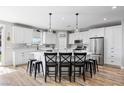 Bright kitchen with modern appliances, white cabinets, and a large center island at 1395 Logandale Dr, Logandale, NV 89021
