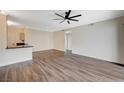 Open floor plan featuring dark wood floors and stylish finishes throughout the main living area at 2900 Sunridge Heights Pkwy # 518, Henderson, NV 89052