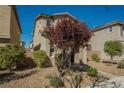 Inviting two-story home showcasing low maintenance landscaping and a charming front yard tree at 3158 Teaderman Walk, Henderson, NV 89044