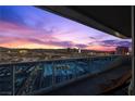Condo balcony showcasing a beautiful skyline sunset view with outdoor seating at 4471 Dean Martin Dr # 2101, Las Vegas, NV 89103