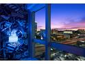 Gorgeous city view from the condo windows showcasing colorful sunset and building lights at dusk at 4471 Dean Martin Dr # 2101, Las Vegas, NV 89103