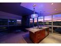Modern kitchen featuring granite counters, stainless appliances, island with seating and an amazing city view at 4471 Dean Martin Dr # 2101, Las Vegas, NV 89103