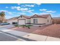 Cozy single-story home with a two-car garage and simple desert-style landscaping at 629 Majestic Sky Dr, North Las Vegas, NV 89031