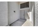 A welcoming entryway features double doors and a modern light fixture at 7900 Holly Knoll Ave, Las Vegas, NV 89129