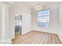 Bright and airy living room with wood floors, large windows and plenty of space at 7900 Holly Knoll Ave, Las Vegas, NV 89129