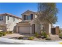 Beautiful two-story home boasts a brick driveway, complemented by well-maintained landscaping, enhancing its inviting appearance at 8106 Skye Glen St, Las Vegas, NV 89166