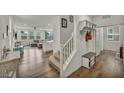 Open-concept living area featuring hardwood floors and modern decor at 9983 Cluny Ave, Las Vegas, NV 89178