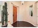 Inviting foyer featuring hardwood floors, a cactus, and decorative niche at 10476 Tyler Park Ave, Las Vegas, NV 89135