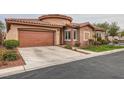 Charming single-story home with a well-maintained front yard and a two car garage at 10476 Tyler Park Ave, Las Vegas, NV 89135