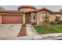 Charming single-story home with a well-maintained front yard and a two car garage at 10476 Tyler Park Ave, Las Vegas, NV 89135