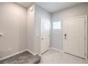 Bright entryway featuring neutral walls and tiled flooring at 10778 Hickam Ave, Las Vegas, NV 89129