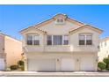 Three-story exterior elevation featuring multi-car garage and desert landscaping at 1634 Clint Canyon Dr, Henderson, NV 89002