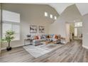 Airy living room boasting high ceilings, large windows, and modern decor with a comfortable sectional sofa and stylish accents at 2033 Shining Feather Ln, Las Vegas, NV 89134