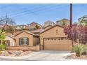 Inviting single-story residence with a neatly maintained front yard and attached garage at 2413 Hamonah Dr, Henderson, NV 89044
