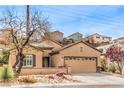 Beautiful single-story home featuring desert landscaping and a cozy, inviting entrance at 2413 Hamonah Dr, Henderson, NV 89044
