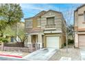 Charming two-story home featuring a well-manicured lawn, desert landscaping and a single-car garage at 3650 Mcmurty Ct, Las Vegas, NV 89129