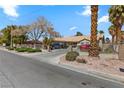 A well-maintained single-story home featuring a tile roof, mature landscaping, and a private driveway at 4300 Del Monte Ave, Las Vegas, NV 89102