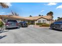 Inviting single-story home featuring a tile roof, a spacious driveway, and well-maintained landscaping at 4300 Del Monte Ave, Las Vegas, NV 89102