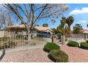 Charming single-story home with manicured landscaping and mature trees providing shade and privacy at 4300 Del Monte Ave, Las Vegas, NV 89102